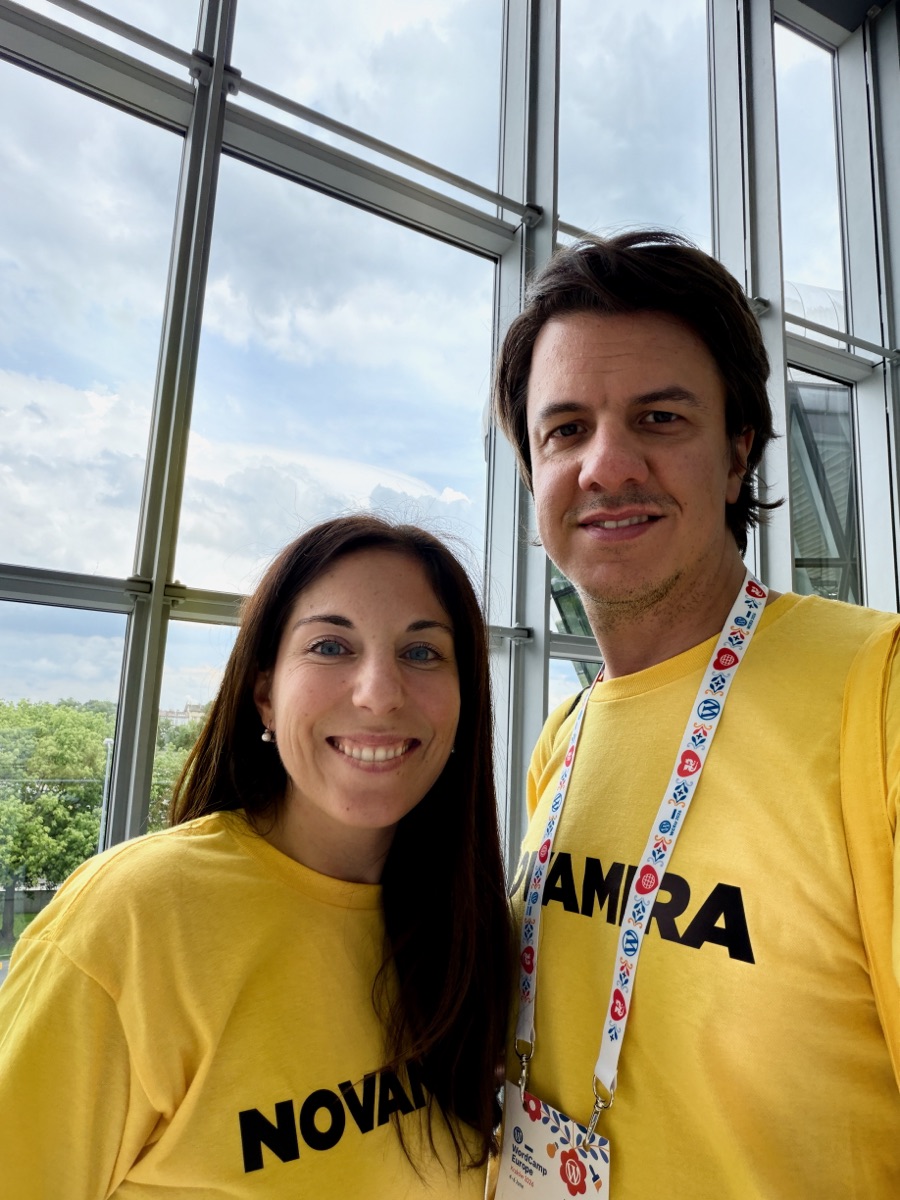 Two members of the Novamira team wearing Novamira t-shirts